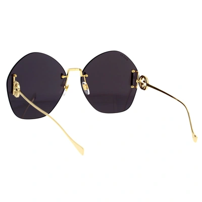 Shop Gucci Eyewear Sunglasses In Gold