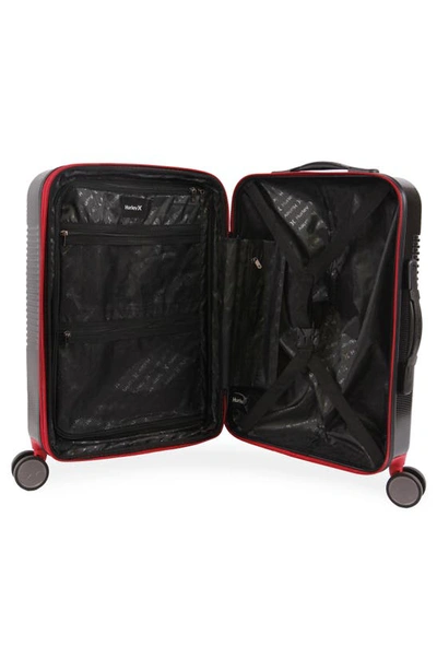 Shop Hurley Looper 21" Hardshell Spinner Suitcase In Black/ Red