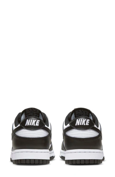 Shop Nike Dunk Low Basketball Sneaker In White/ Black/ White