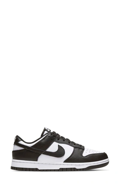 Shop Nike Dunk Low Basketball Sneaker In White/ Black/ White