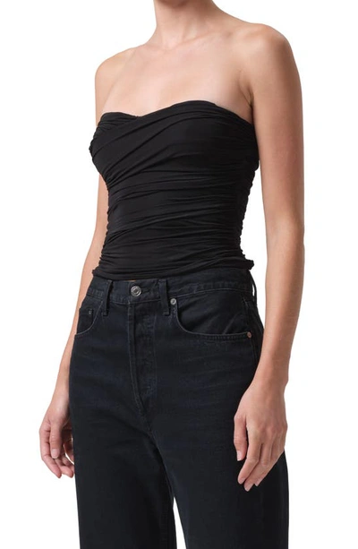 Shop Agolde Tonia Twist Strapless Tube Top In Black