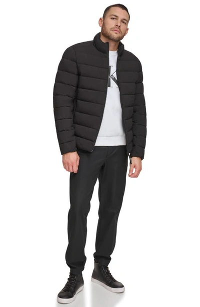 Shop Calvin Klein Stretch Puffer Jacket In Ebony