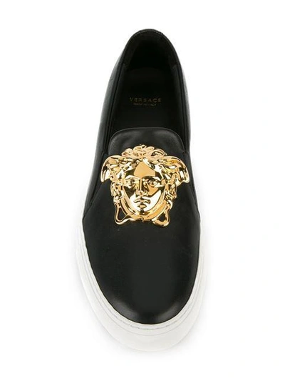 Shop Versace Medusa Slip-on Sneakers - Black