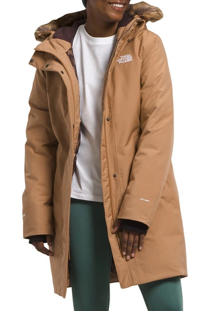 Shop The North Face Arctic Waterproof 600-fill-power Down Parka With Faux Fur Trim In Almond Butter Tnf Monogram Lrg