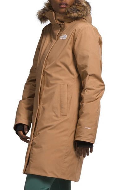 Shop The North Face Arctic Waterproof 600-fill-power Down Parka With Faux Fur Trim In Almond Butter Tnf Monogram Lrg
