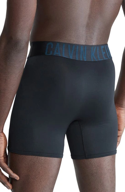 Shop Calvin Klein 3-pack Boxer Briefs In Black/ Teal Blue Band