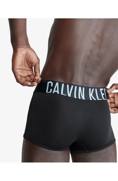 Shop Calvin Klein Assorted 3-pack Intense Power Micro Low Rise Trunks In Black/ Teal Blue Band