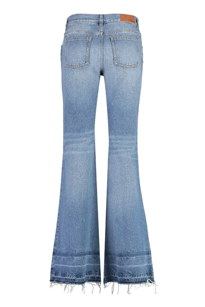 Shop Chloé Low-rise Flared Jeans In Denim
