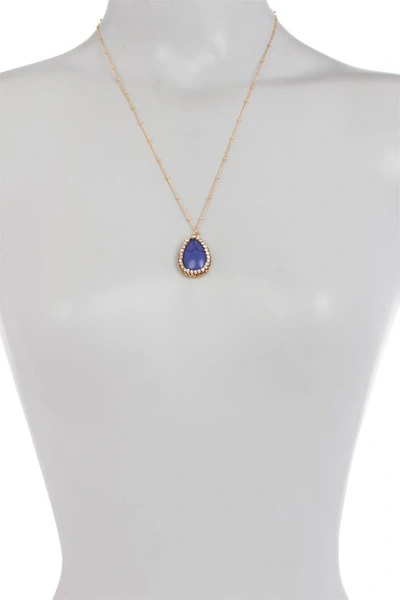 Shop Olivia Welles Liv Halo Set Simulated Turquoise Pendant Stationed Stone Necklace In Gold-blue
