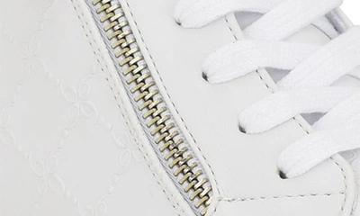 Shop Nine West Tons Lace-up Wedge Sneaker In White