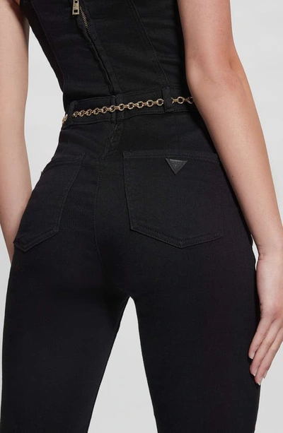 Shop Guess Belted Denim Jumpsuit In Black