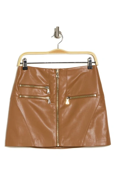 Shop Alice And Olivia Kendale Moto Faux Leather Miniskirt In Camel
