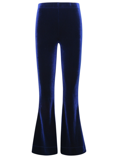 Shop Ganni Flared Blue Velvet Jersey Pants