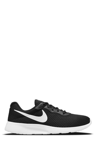 Shop Nike Tanjun Athletic Sneaker In Black/white-barely Volt-black