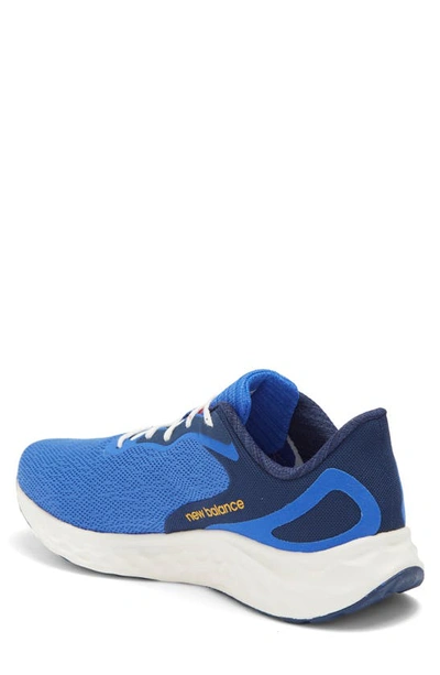 Shop New Balance Fresh Foam Arishi V4 Sneaker In Marine Blue/ Hot Marigold