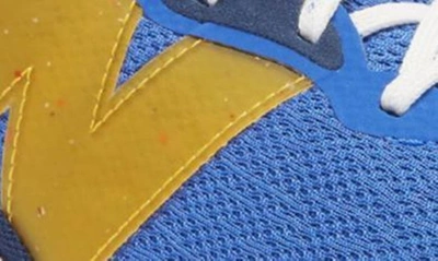 Shop New Balance Fresh Foam Arishi V4 Sneaker In Marine Blue/ Hot Marigold