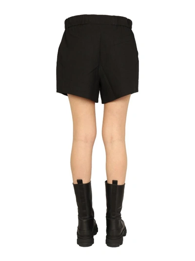 Shop Ganni Ruffled Elastic Shorts In Black