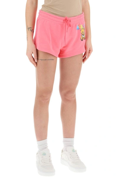 Shop Moschino Logo Printed Shorts In Fuchsia