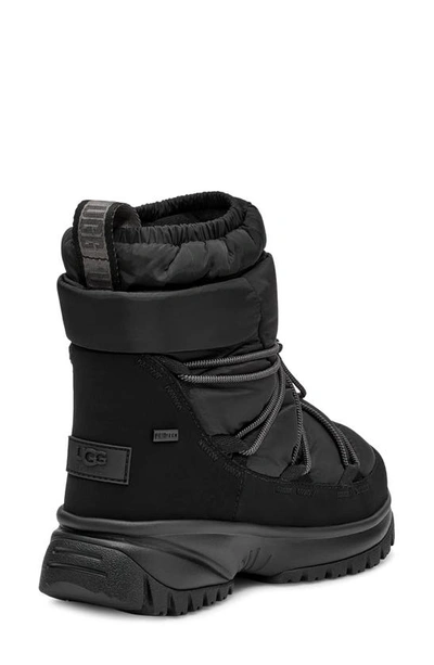 Shop Ugg Yose Genuine Shearling Lined Mid Puffer Boot In Black