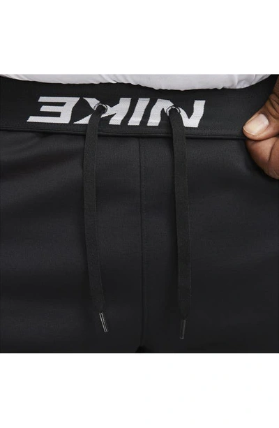 Shop Nike Therma-fit Sweatpants In Black/ Black/ White
