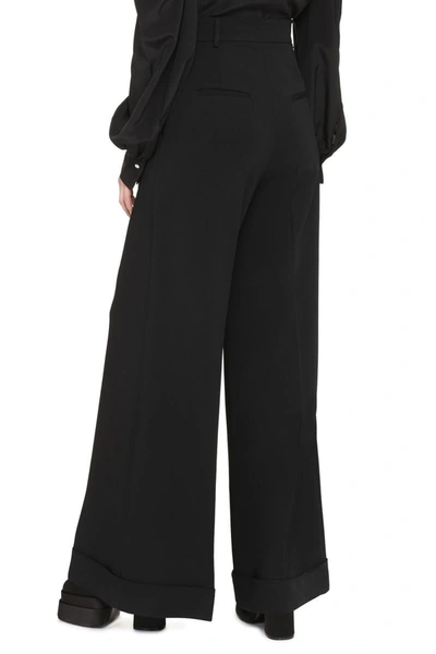 Shop Moschino High-waist Wide-leg Trousers In Black