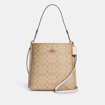 Shop Coach Outlet Mollie Bucket Bag In Signature Canvas In Beige