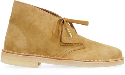 Shop Clarks Suede Desert Boots In Beige