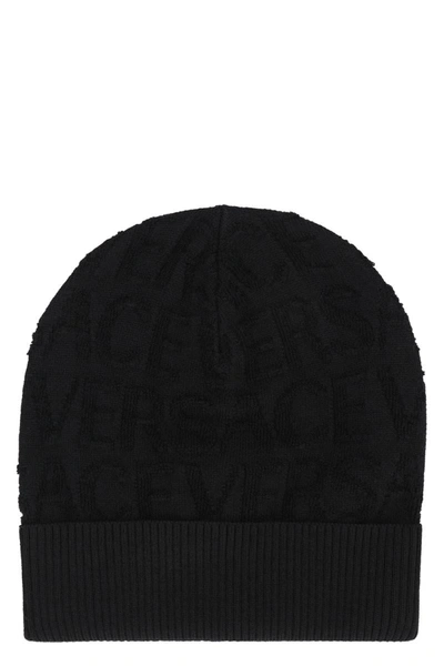 Shop Versace All-over Logoed Wool Bean Hat In Black