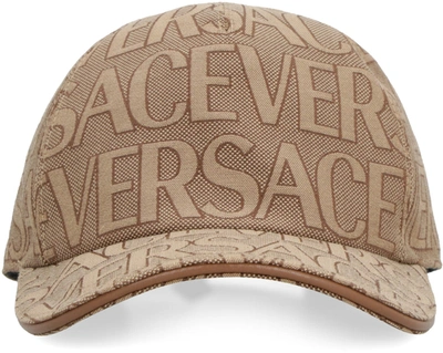Shop Versace All Over Logo Baseball Cap In Beige