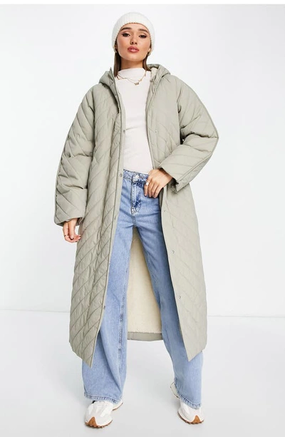 Shop Asos Design Chevron Quilted Hooded Longline Coat With Fleece Lining In Stone
