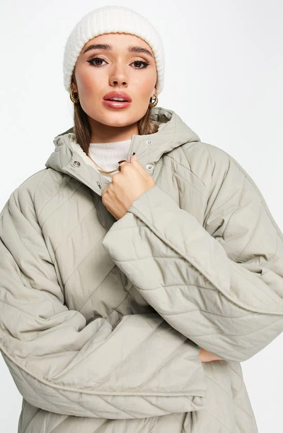 Shop Asos Design Chevron Quilted Hooded Longline Coat With Fleece Lining In Stone