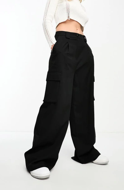 Shop Asos Design Oversize Cargo Pants In Black