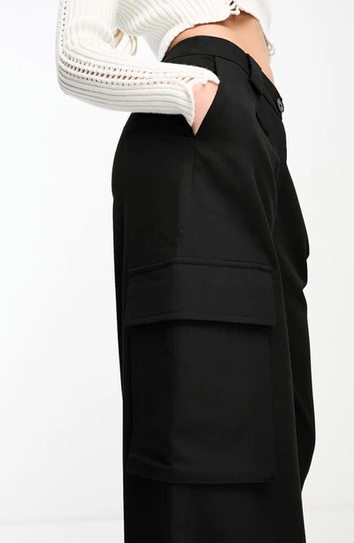 Shop Asos Design Oversize Cargo Pants In Black