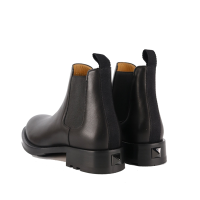 Shop Valentino Garavani  Garavani Roman Stud Leather Boots