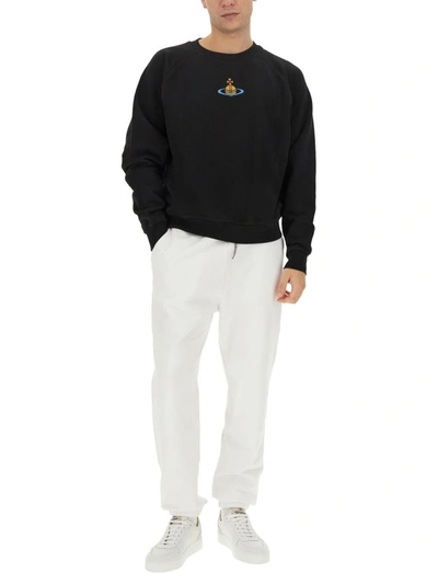 Shop Vivienne Westwood Jogging Pants With Logo Unisex In White