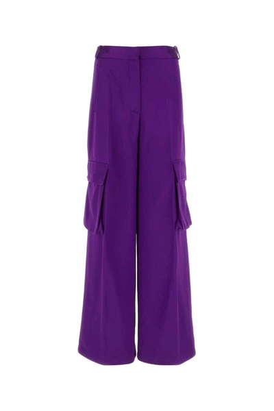 Shop Versace Pants In Purple