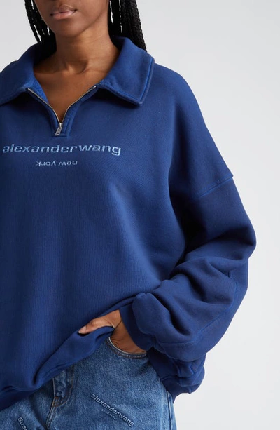 Shop Alexander Wang Gender Inclusive Embossed Logo Loose Fit Straight Leg Jeans In 401 Deep Blue