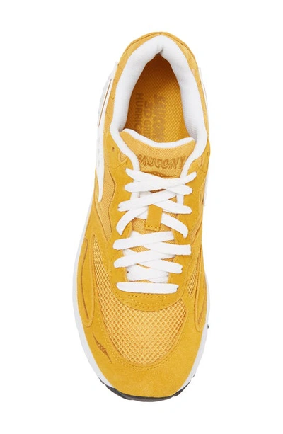 Shop Saucony 3d Grid Hurricane Sneaker In Mustard/ White