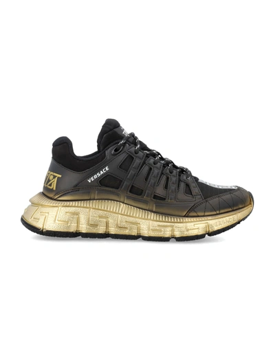 Shop Versace The Trigreca Trainers In Black/gold