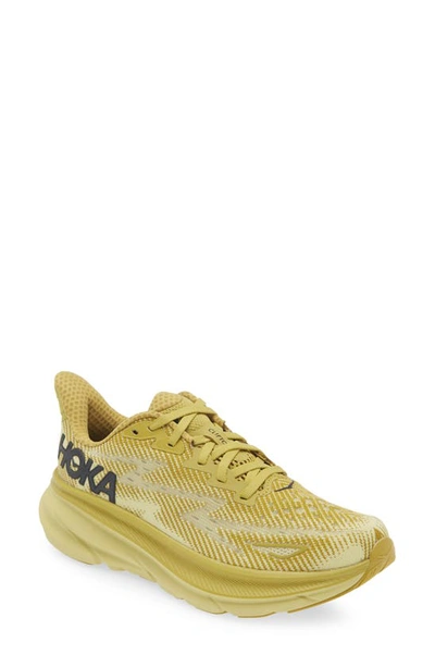 Shop Hoka Clifton 9 Running Shoe In Golden Lichen / Celery Root