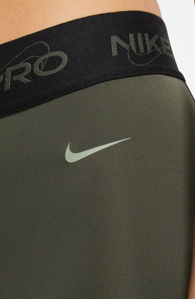 Shop Nike Pro Dri-fit Mid-rise 7/8 Leggings In Cargo Khaki/ Black