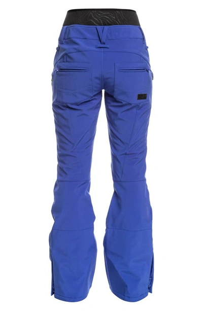 Shop Roxy Rising High Waterproof Shell Snow Pants In Bluing