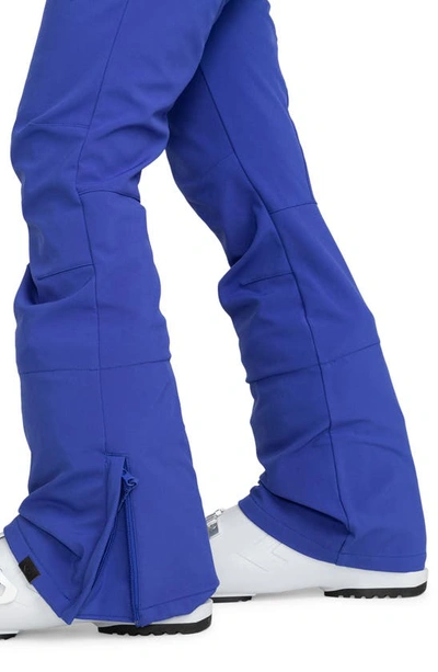 Shop Roxy Rising High Waterproof Shell Snow Pants In Bluing