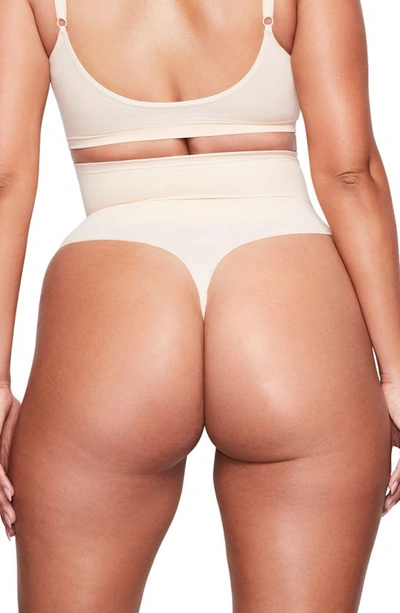 Shop Skims Core Control Thong In Sand