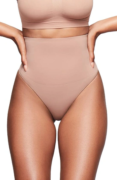 Shop Skims Core Control Thong In Sienna