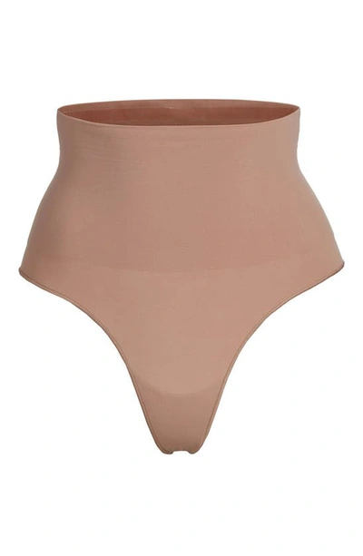 Shop Skims Core Control Thong In Sienna