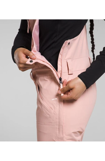 Shop The North Face Freedom Waterproof Snow Bib Overalls In Pink Moss