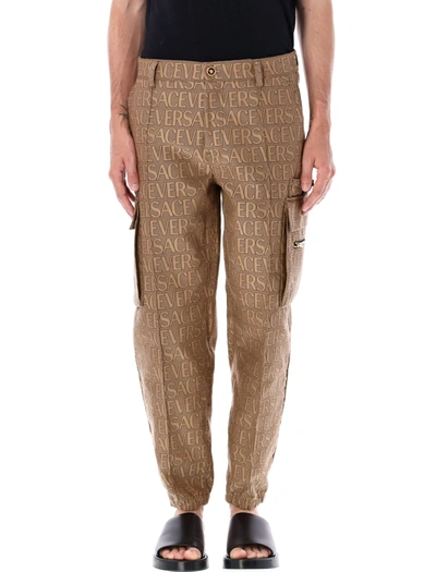 Shop Versace Allover Cargo Trousers In Brown Beige