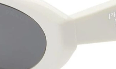 Shop Prada 56mm Oval Sunglasses In Bone