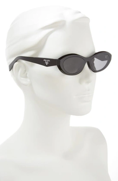 Shop Prada 56mm Oval Sunglasses In Black